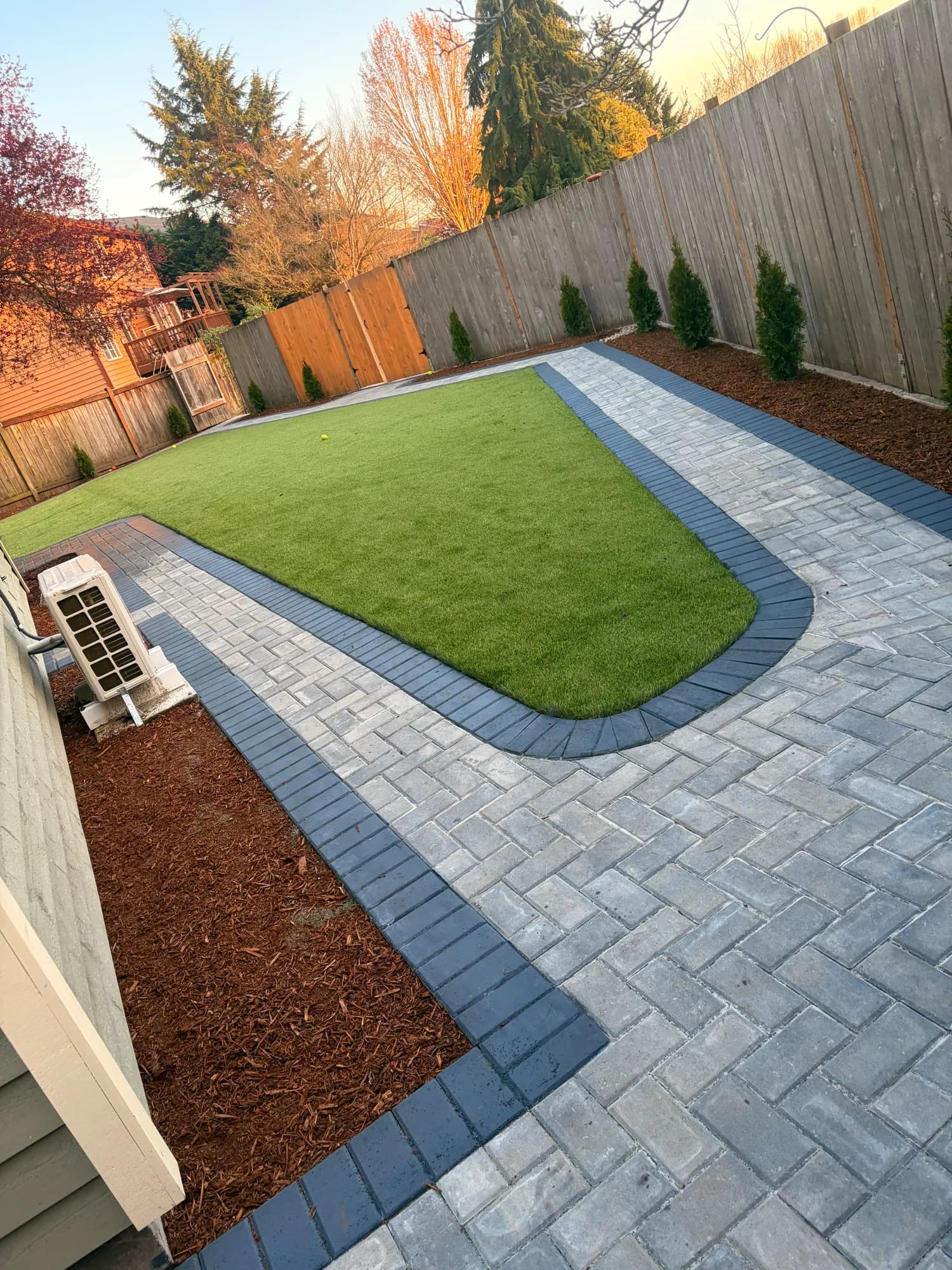 Artificial turf with paver border completed